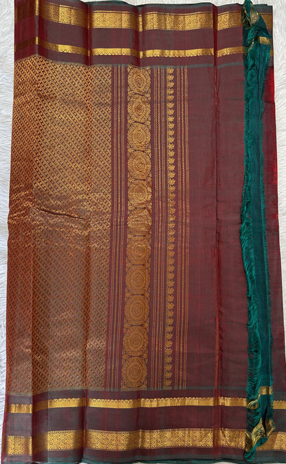 Gadwal Sico Saree Red colored complemented with a Bottle Green Kanchi Gap Border. - Sampradaya Designer Studio