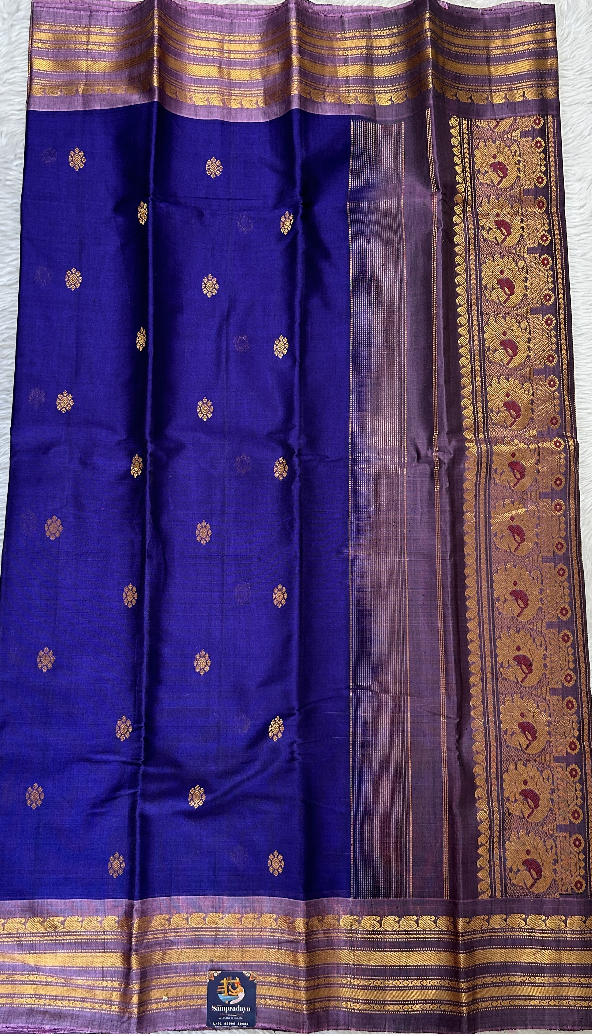 Gadwal Sico Saree Deep Blue colored complemented with a Lavender Kanchi Gap Border. - Sampradaya Designer Studio