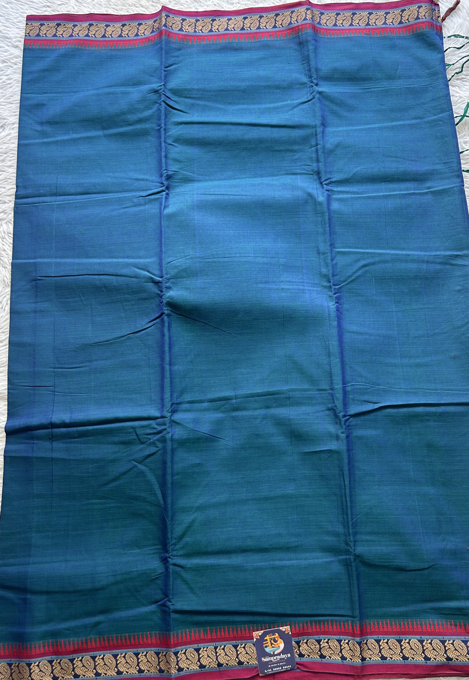 Narayanpet Cotton Saree Peacock Blue Colored Complemented with a Thread Border. - Sampradaya Designer Studio