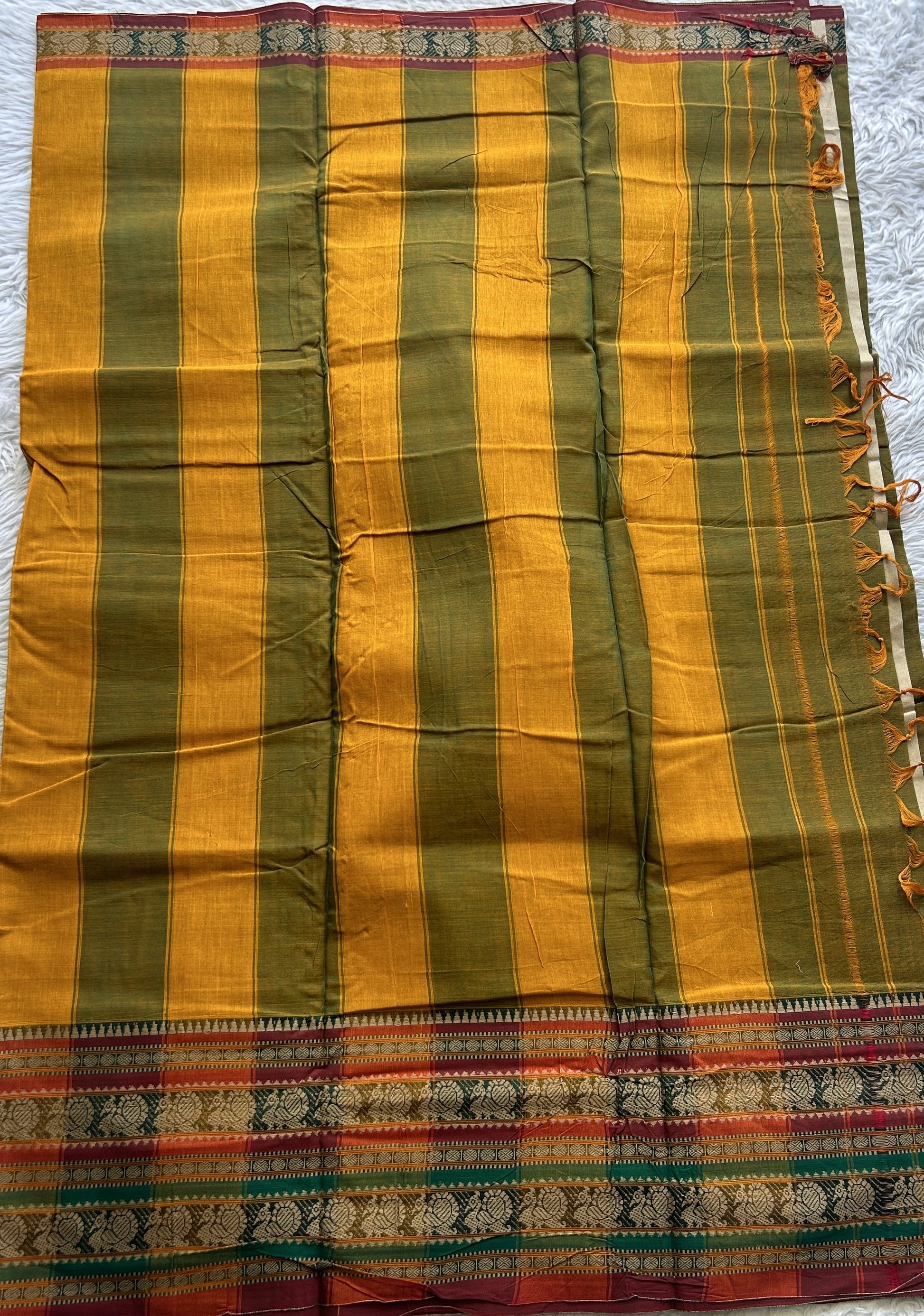 Narayanpet Cotton Saree Olive Green Colored Complemented with a Thread Border. - Sampradaya Designer Studio
