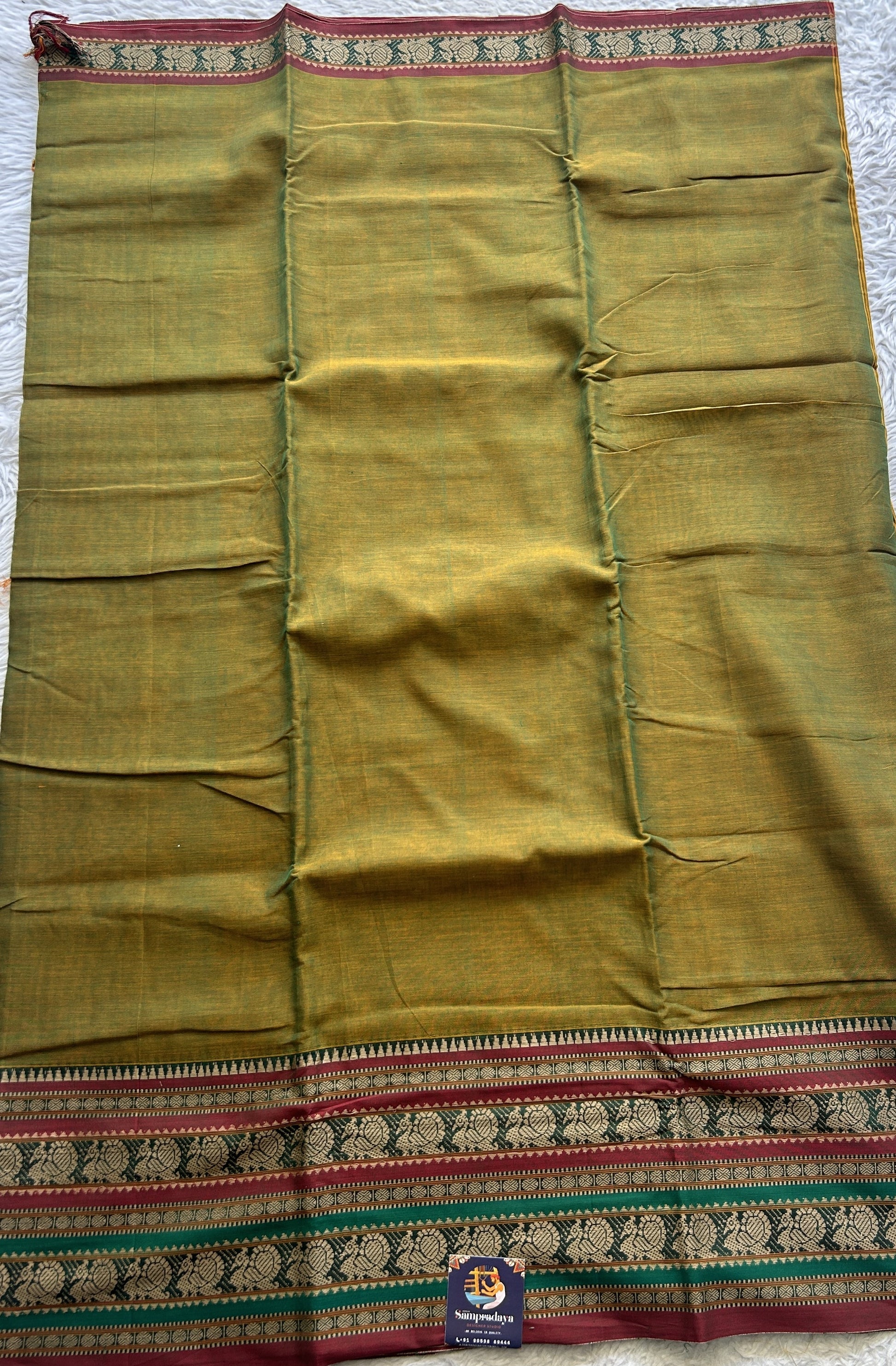 Narayanpet Cotton Saree Olive Green Colored Complemented with a Thread Border. - Sampradaya Designer Studio