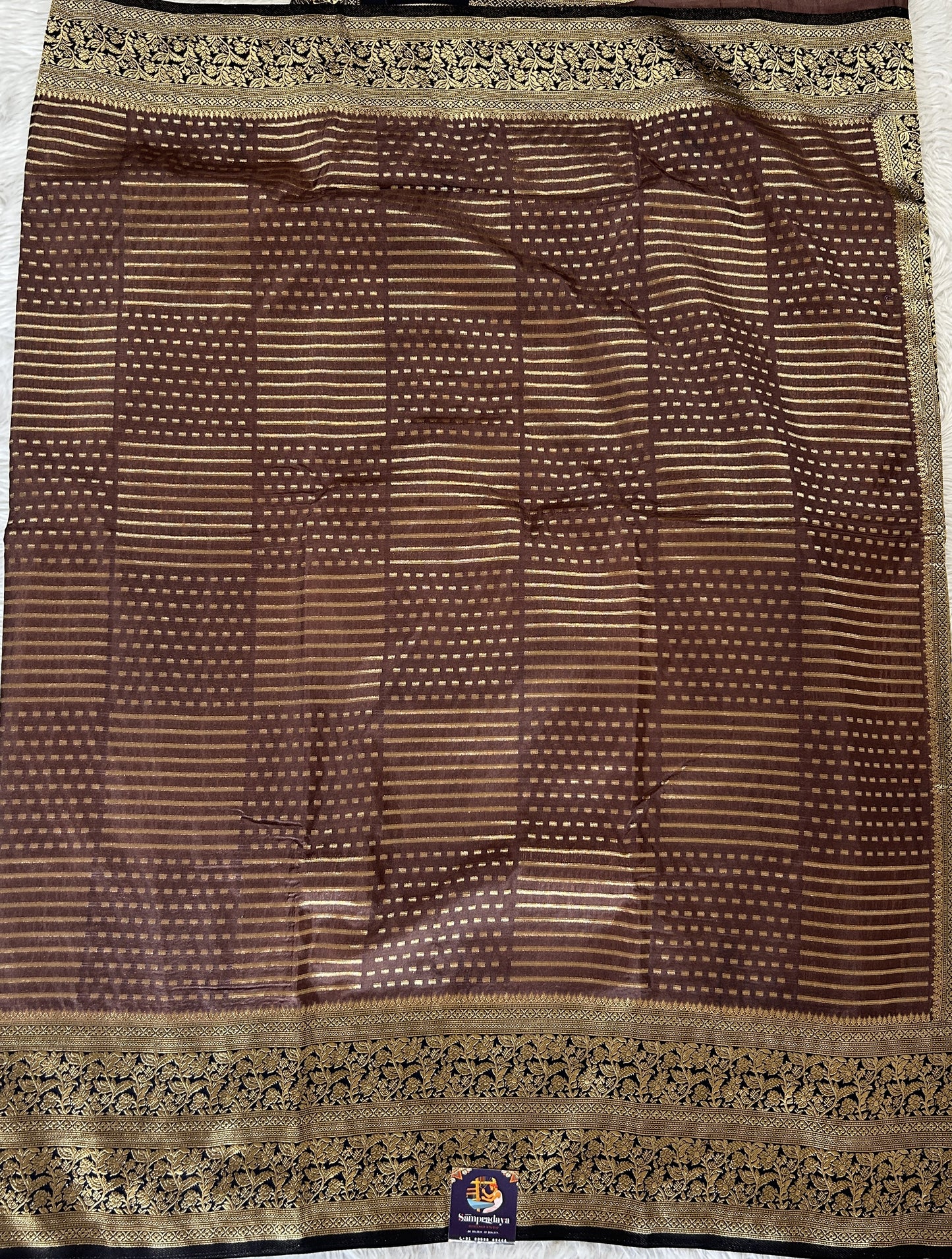 Banarasi Fancy Saree Rust Colored Complemented with a Navy Blue Zari Border. - Sampradaya Designer Studio