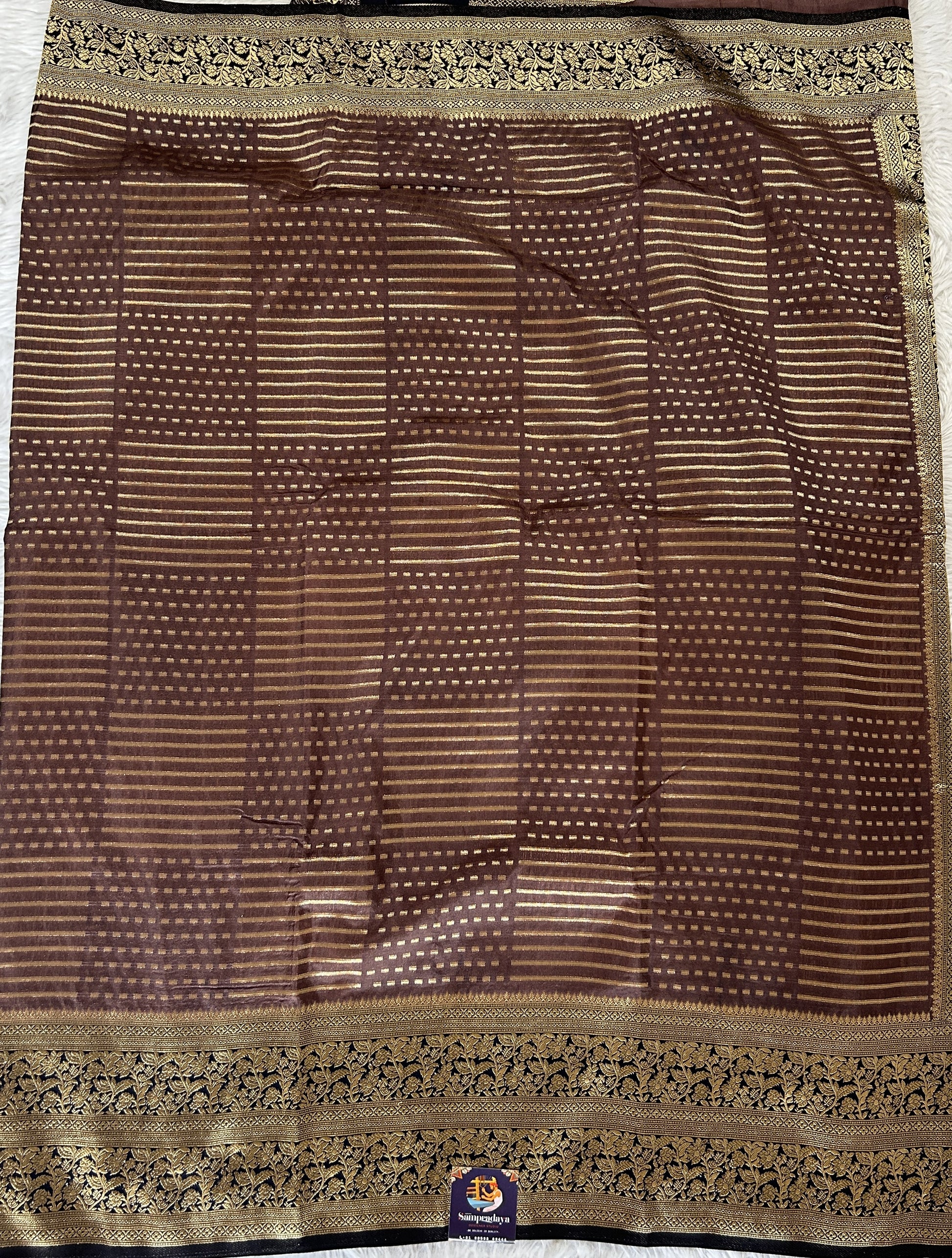 Banarasi Fancy Saree Rust Colored Complemented with a Navy Blue Zari Border. - Sampradaya Designer Studio