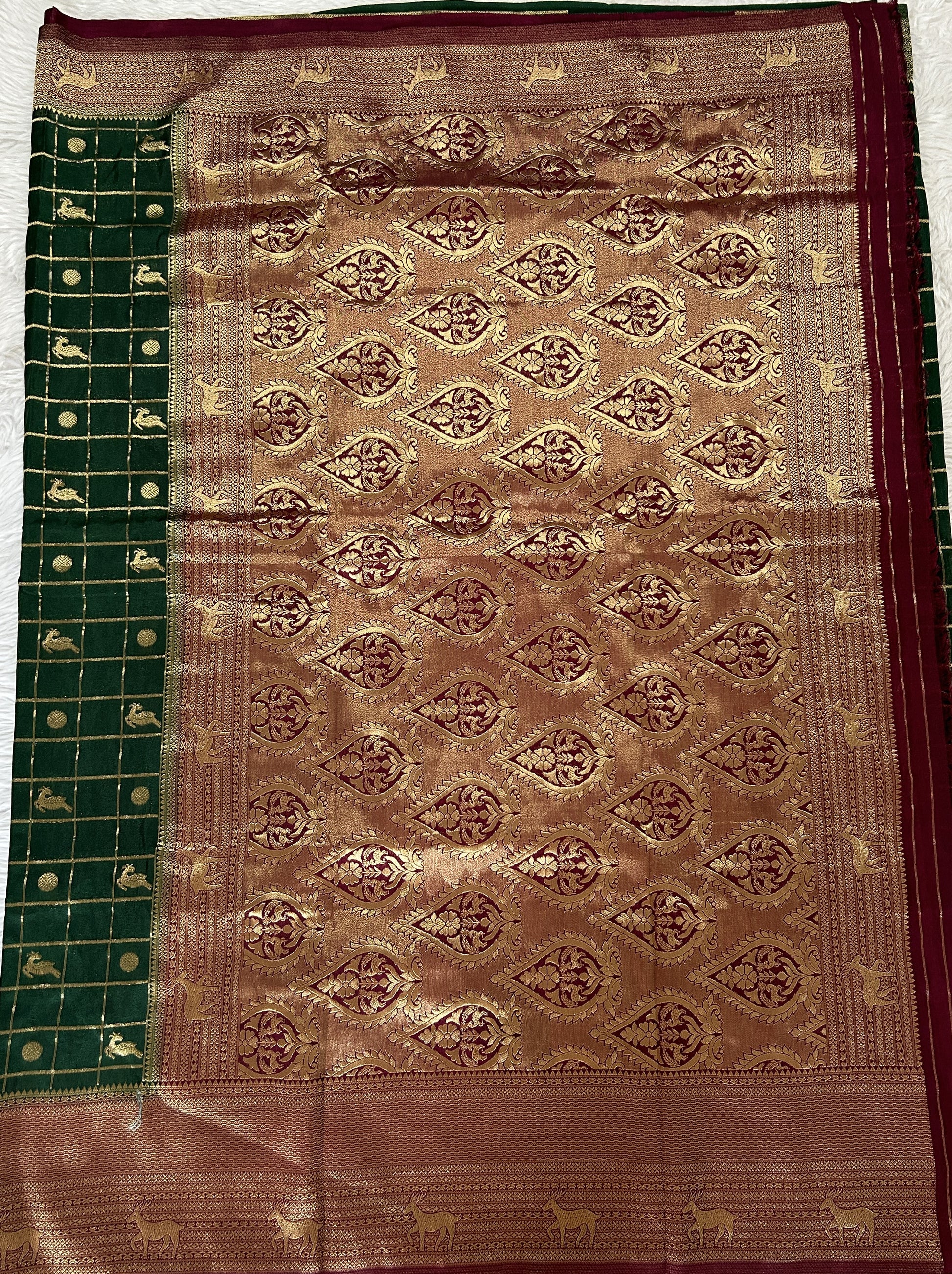 Banarasi Fancy Saree Bottle Green Colored Complemented with a Magenta Zari Border. - Sampradaya Designer Studio