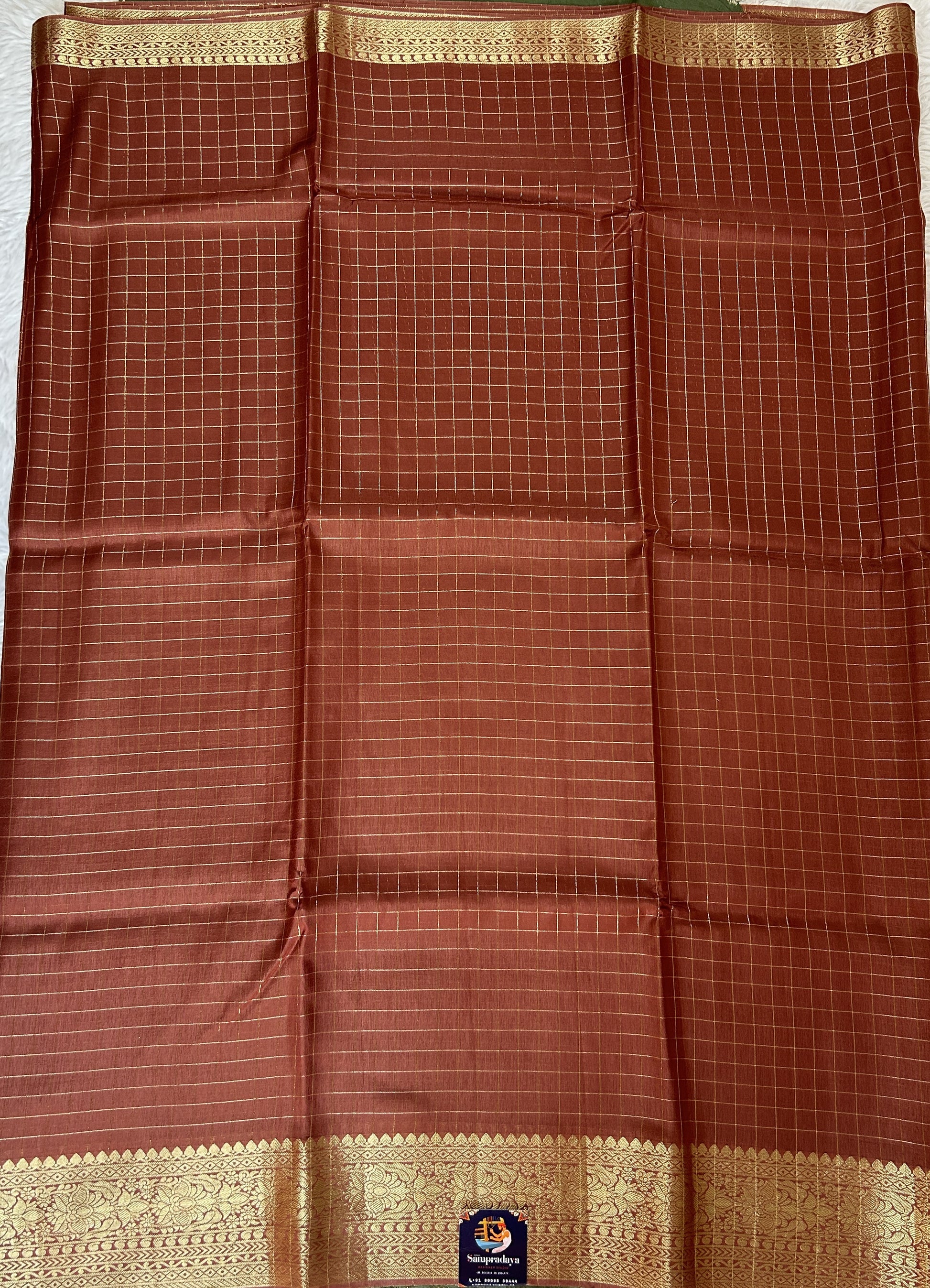 Banarasi Fancy Saree Rust Colored Complemented with a Zari Border. - Sampradaya Designer Studio