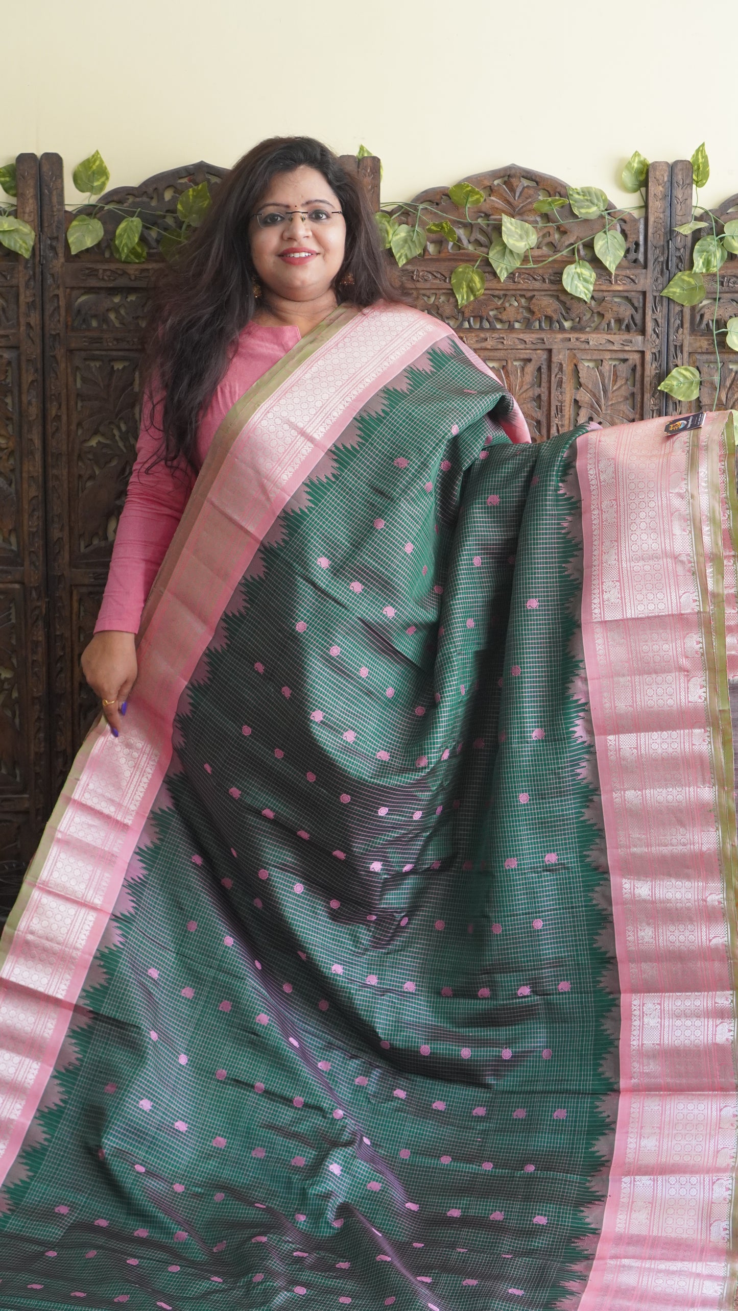 Gadwal Silk Saree Bottle Green Colored Complemented With a Zari Border - Sampradaya Designer Studio