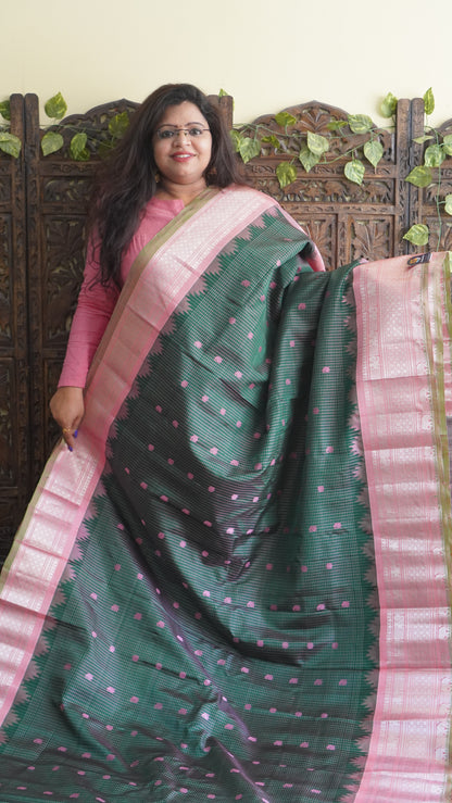 Gadwal Silk Saree Bottle Green Colored Complemented With a Zari Border - Sampradaya Designer Studio