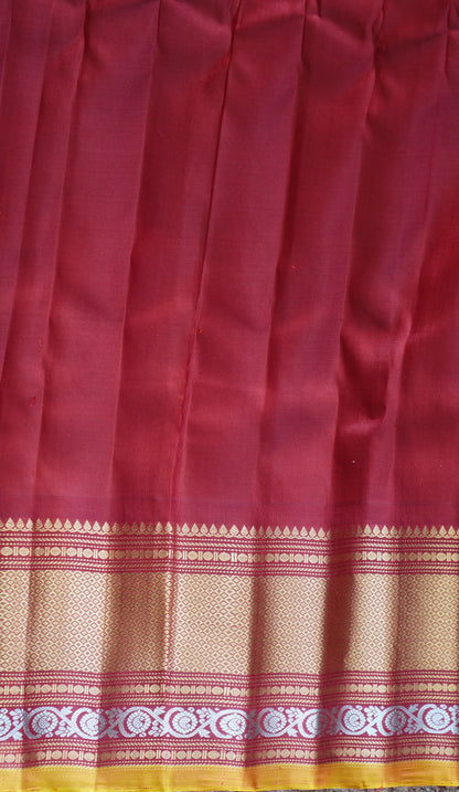 Gadwal Silk Saree Light Green Colored Complemented With a Red Zari Border - Sampradaya Designer Studio