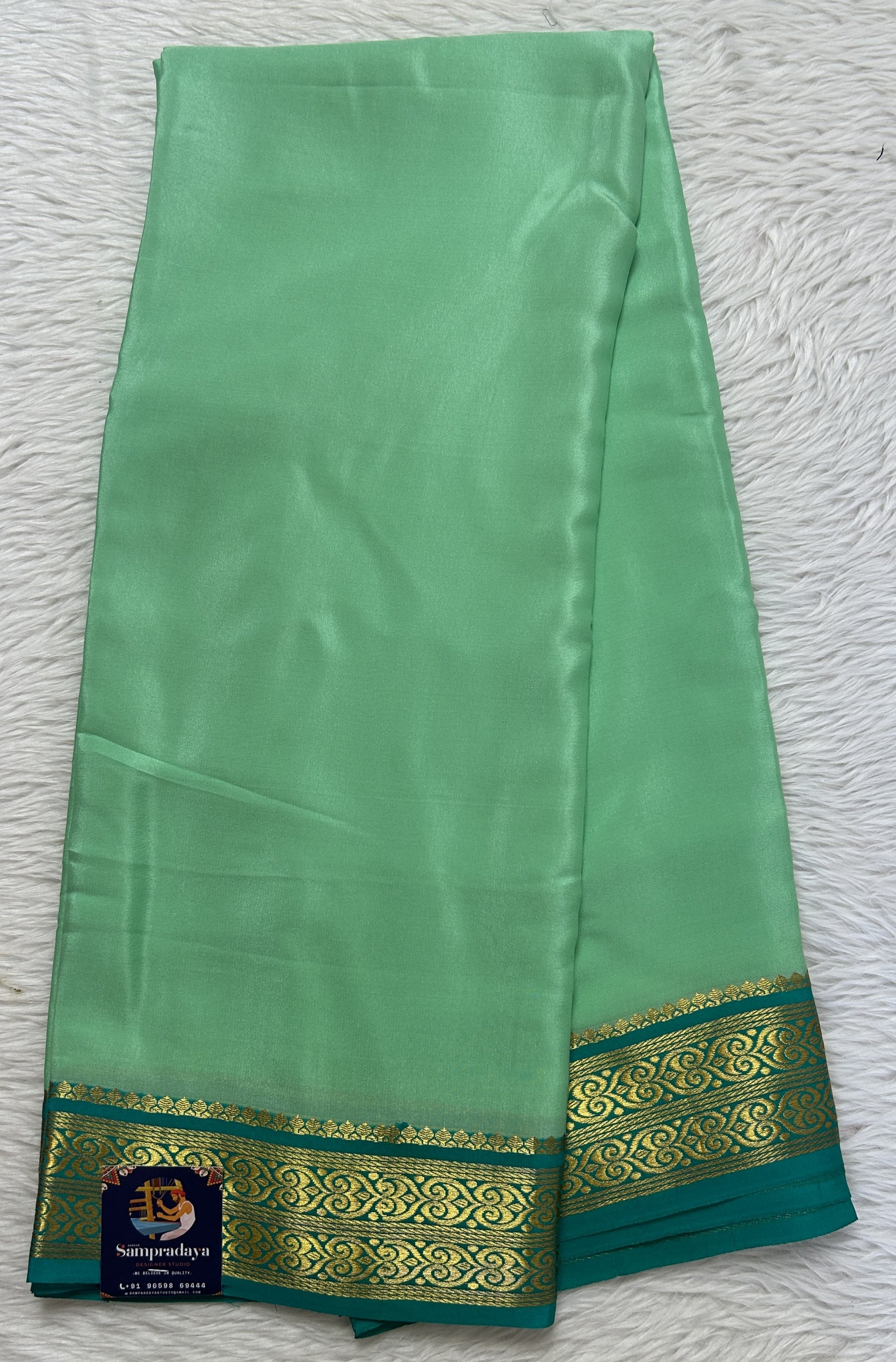 Mysore Crepe Silk Saree Pastel Green Colored Complemented with a Sea Green Zari Border. - Sampradaya Designer Studio