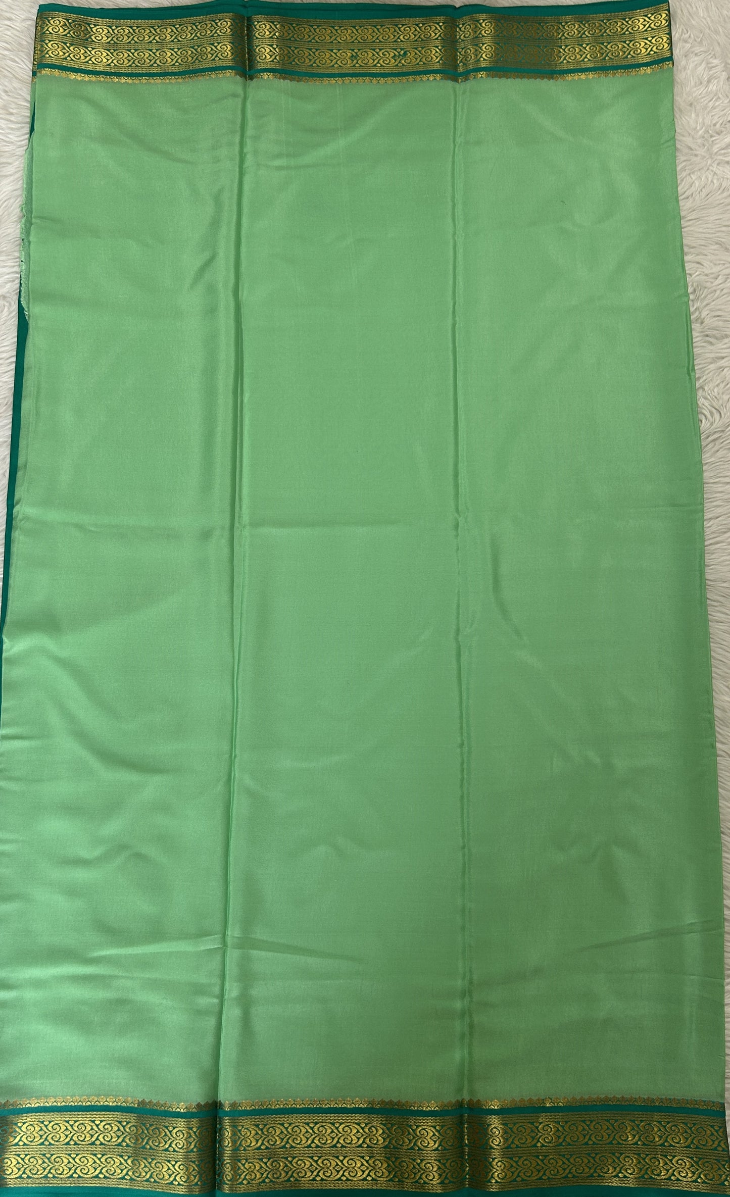 Mysore Crepe Silk Saree Pastel Green Colored Complemented with a Sea Green Zari Border. - Sampradaya Designer Studio