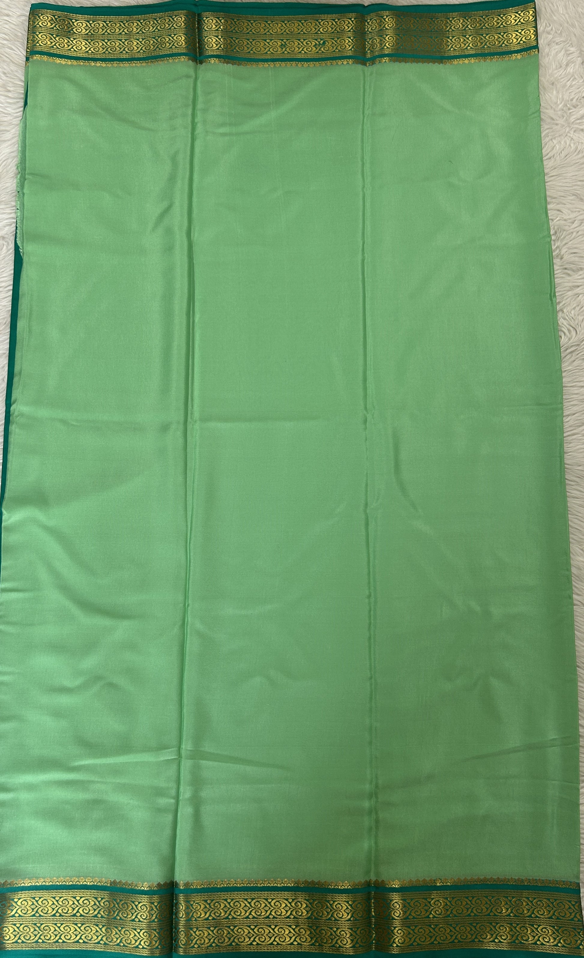 Mysore Crepe Silk Saree Pastel Green Colored Complemented with a Sea Green Zari Border. - Sampradaya Designer Studio