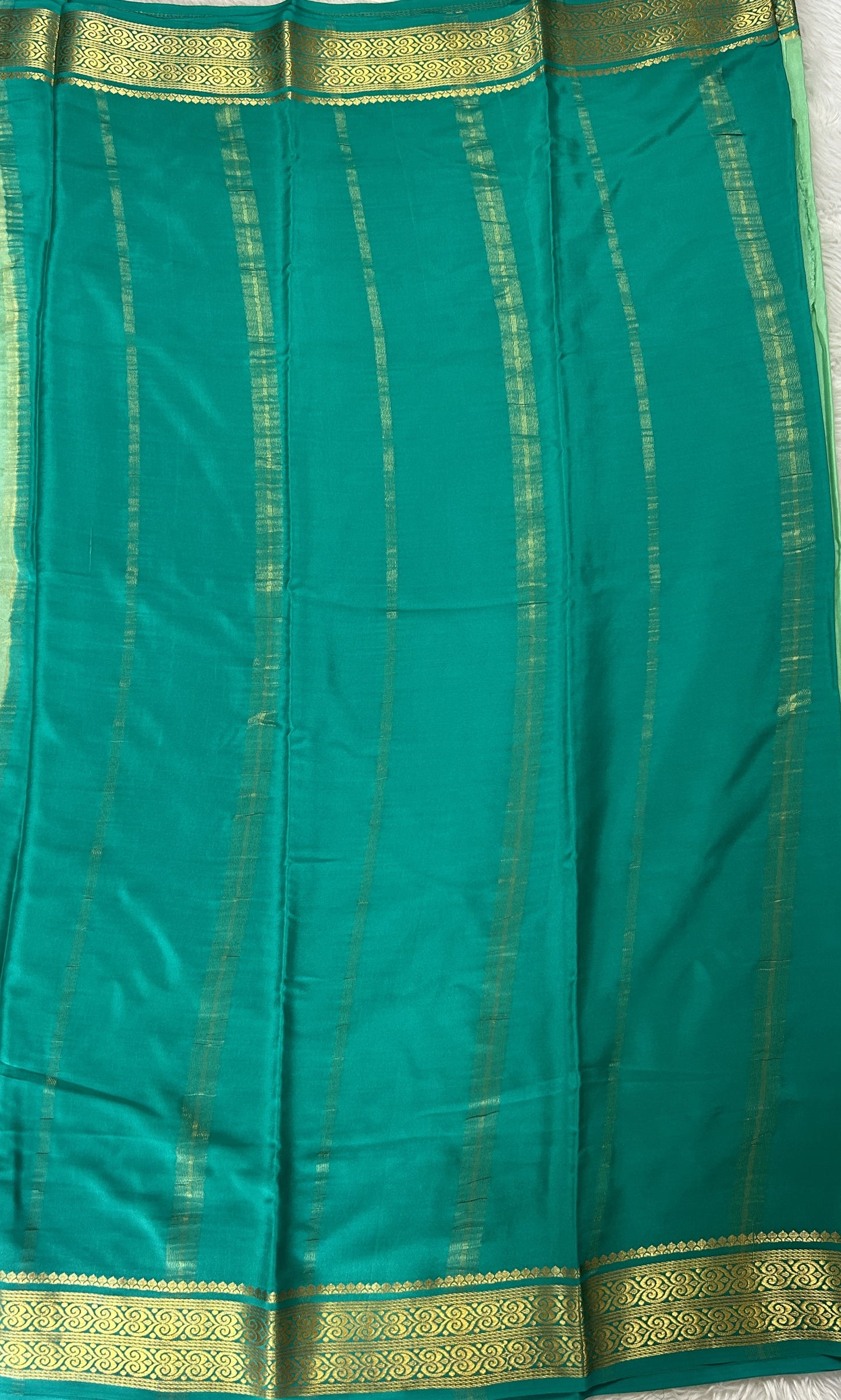 Mysore Crepe Silk Saree Pastel Green Colored Complemented with a Sea Green Zari Border. - Sampradaya Designer Studio