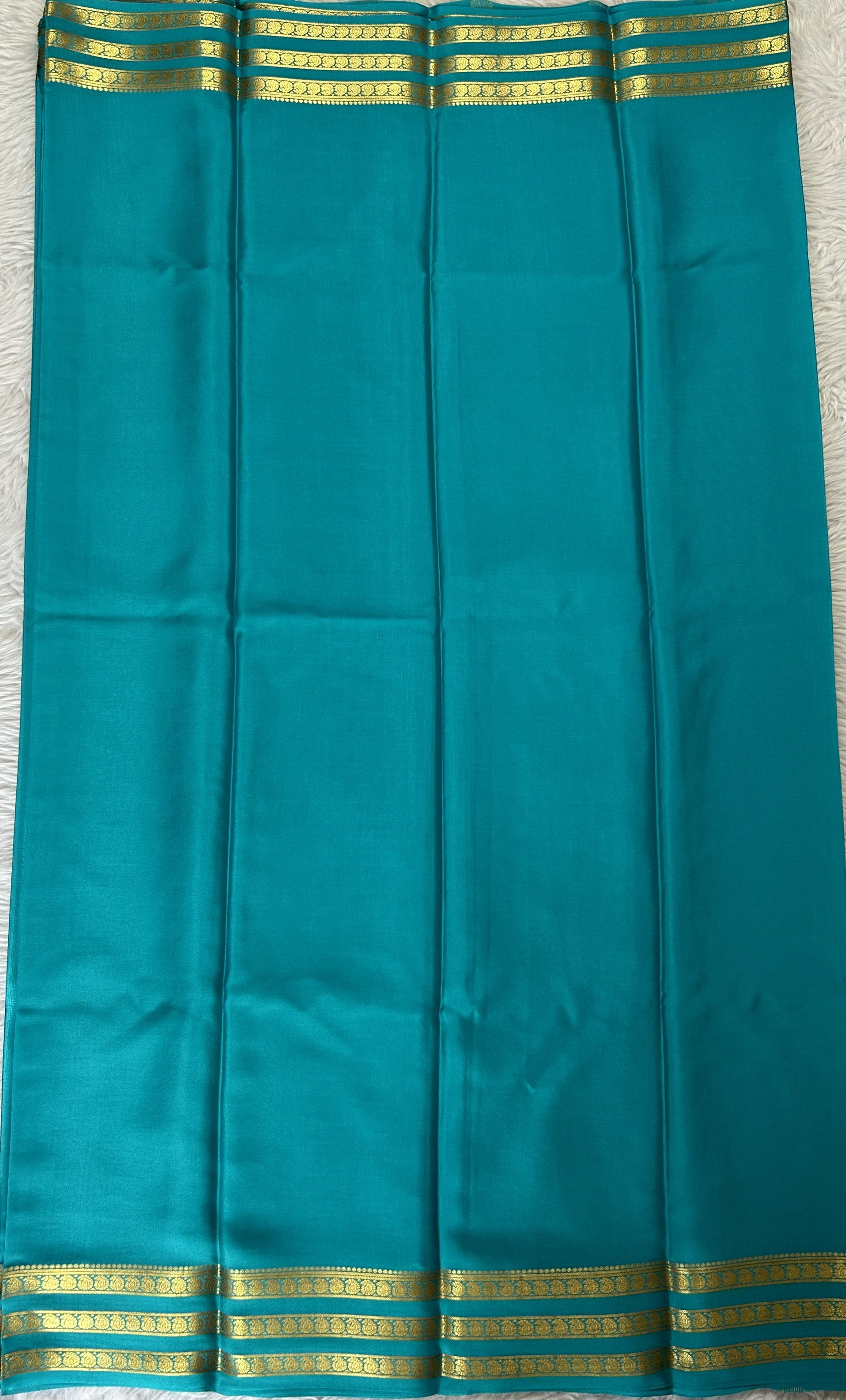 Mysore Crepe Silk Saree Sea Blue Colored Complemented with a Zari Gap Border. - Sampradaya Designer Studio