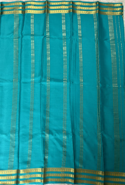 Mysore Crepe Silk Saree Sea Blue Colored Complemented with a Zari Gap Border. - Sampradaya Designer Studio