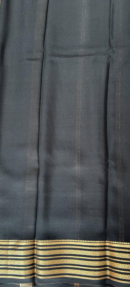 Mysore Crepe Silk Saree Light Gray Colored Complemented with a Black Zari Border. - Sampradaya Designer Studio