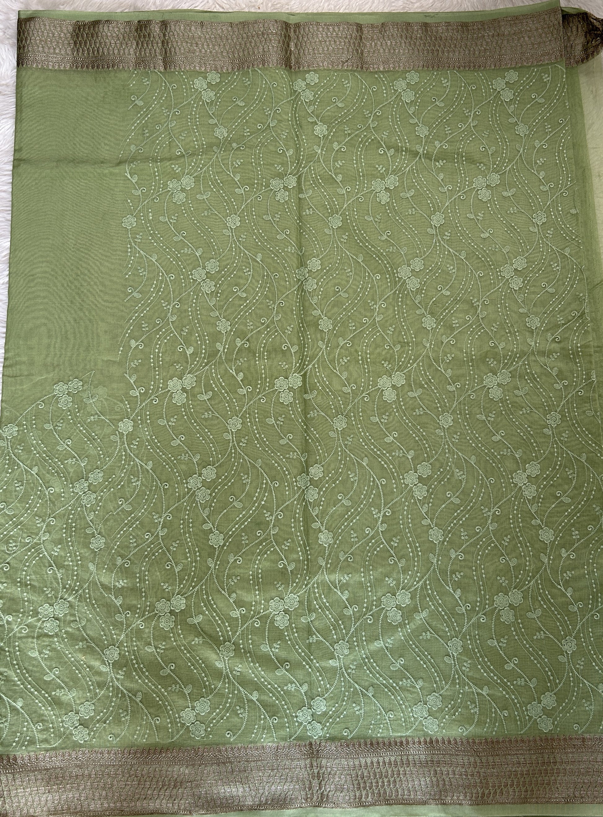 Semi Tussar Silk Saree Green colored complemented with a Zari border. - Sampradaya Designer Studio