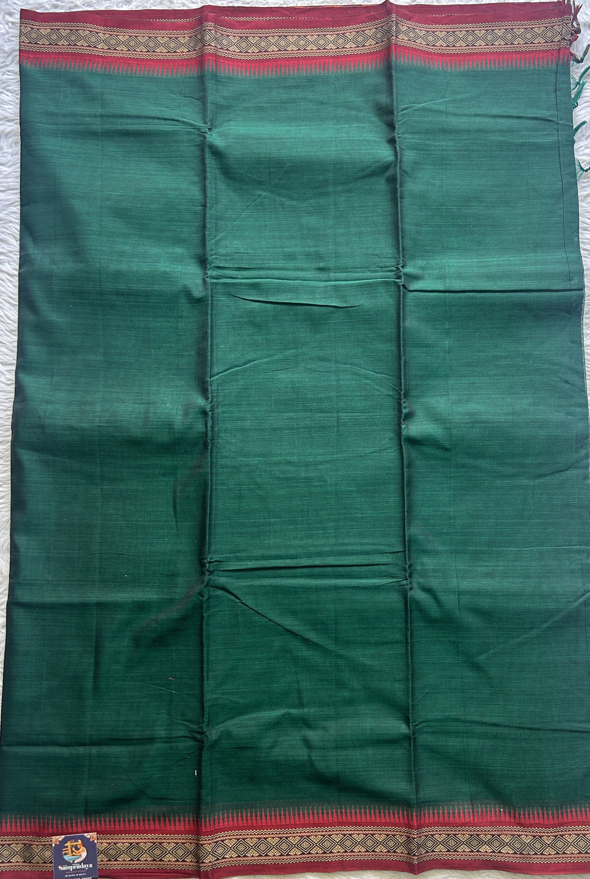 Narayanpet Cotton Saree Bottle Green Colored Complemented with a Thread Border. - Sampradaya Designer Studio