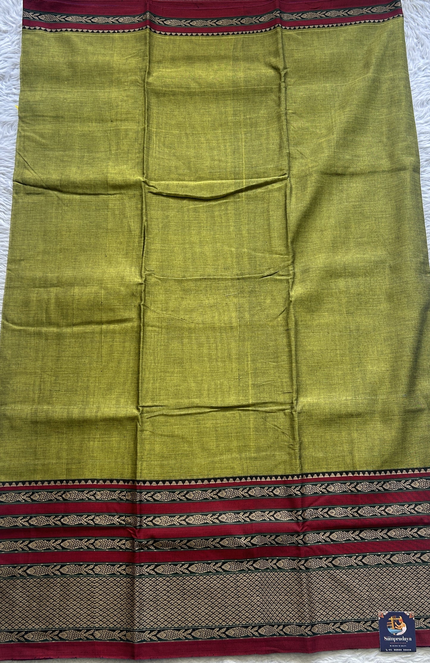 Narayanpet Cotton Saree Olive Green Colored Complemented with a Gap Border. - Sampradaya Designer Studio