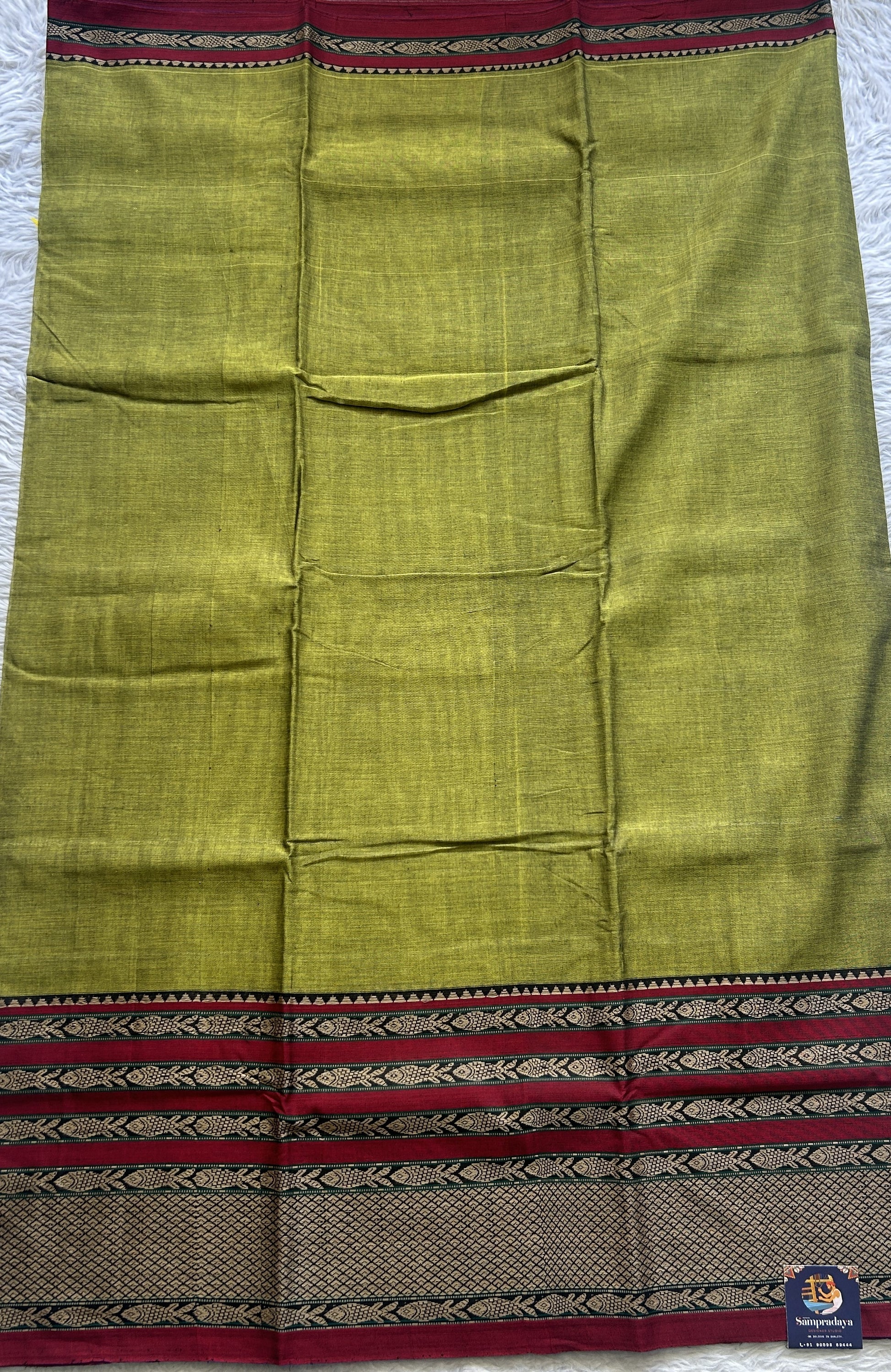 Narayanpet Cotton Saree Olive Green Colored Complemented with a Gap Border. - Sampradaya Designer Studio