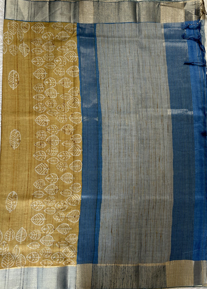 Semi Tussar Saree Wheat Color Complemented with a Blue Zari Border. - Sampradaya Designer Studio