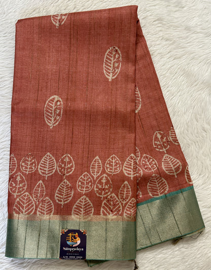 Semi Tussar Saree Rust Color Complemented with a Sea Blue Zari Border. - Sampradaya Designer Studio