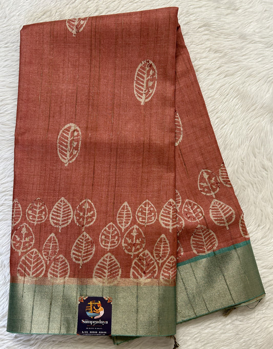 Semi Tussar Saree Rust Color Complemented with a Sea Blue Zari Border. - Sampradaya Designer Studio