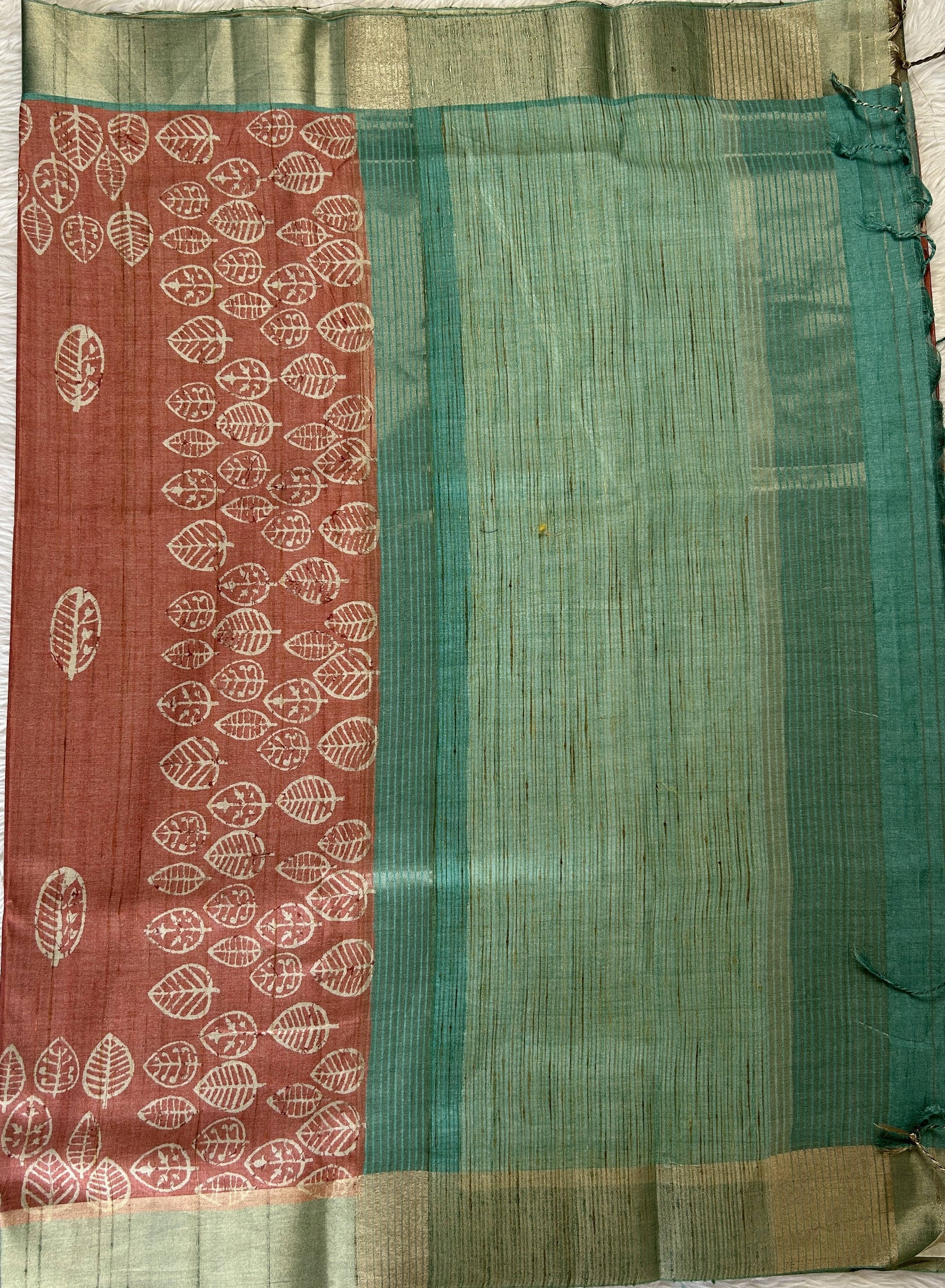 Semi Tussar Saree Rust Color Complemented with a Sea Blue Zari Border. - Sampradaya Designer Studio