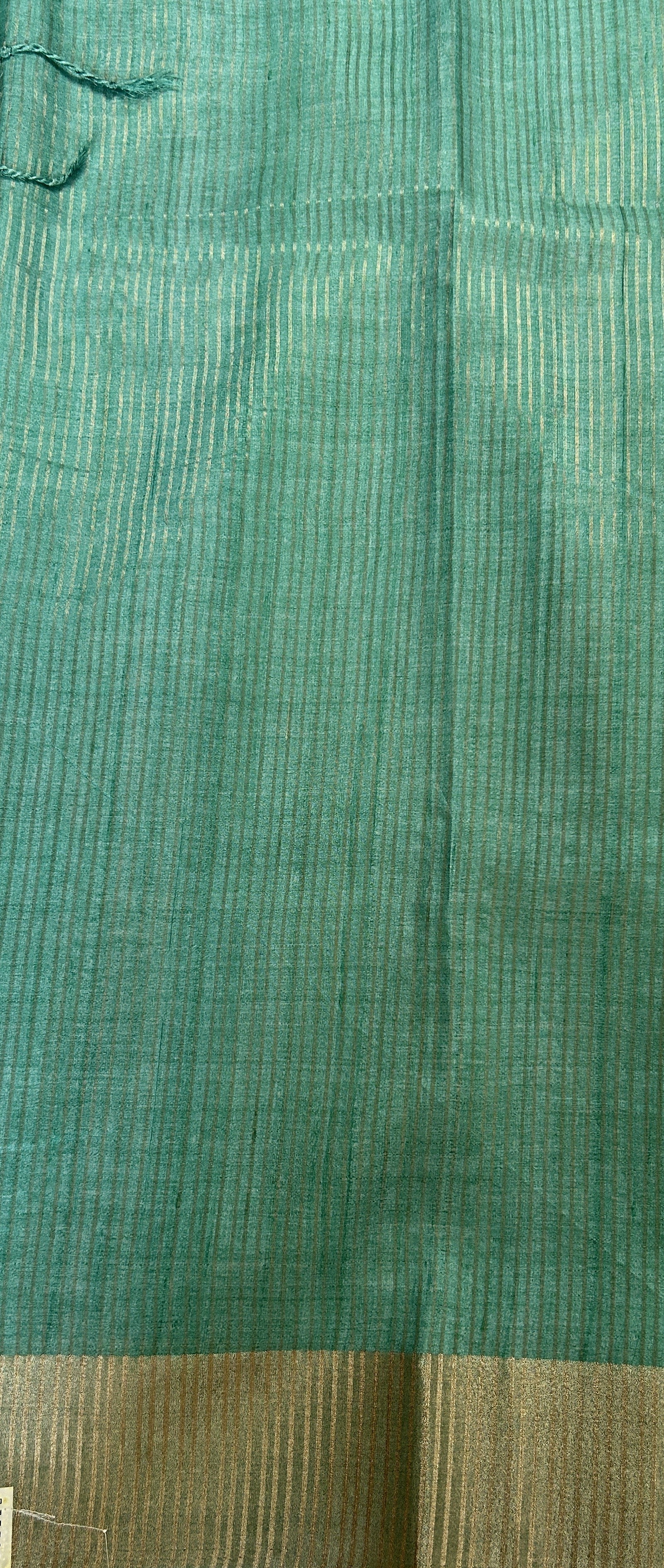 Semi Tussar Saree Rust Color Complemented with a Sea Blue Zari Border. - Sampradaya Designer Studio