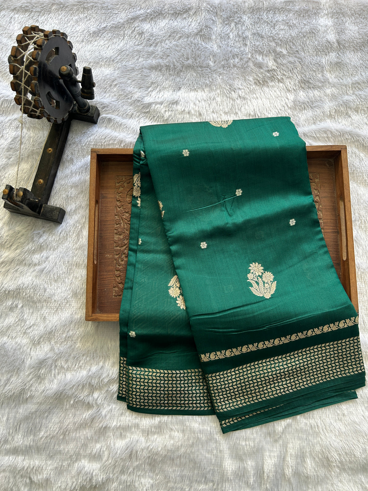 Pure Chiniya Silk Saree Bottle Green Colored Elegantly Paired with a Gold Zari Border.