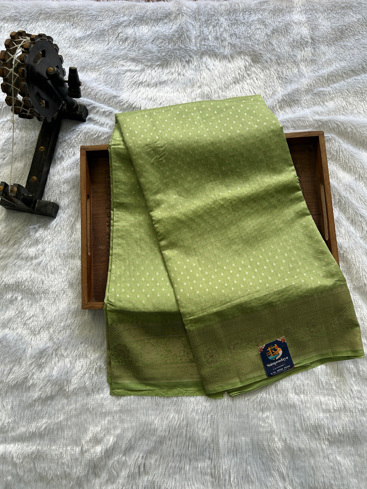 Pure Chiniya Silk Saree Mint Light Green Colored Elegantly Paired with a Gold Zari Border.