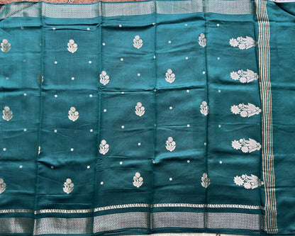 Pure Chiniya Silk Saree Bottle Green Colored Elegantly Paired with a Gold Zari Border.