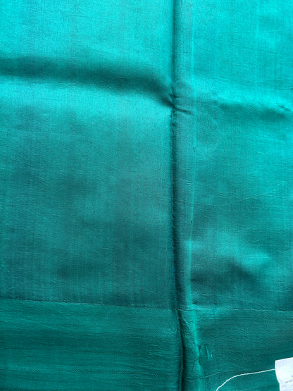 Pure Chiniya Silk Saree Bottle Green Colored Elegantly Paired with a Gold Zari Border.