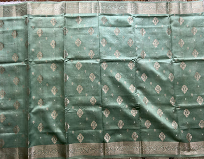 Pure Chiniya Silk Saree Sea Green Colored Elegantly Paired with a Gold Zari Border.