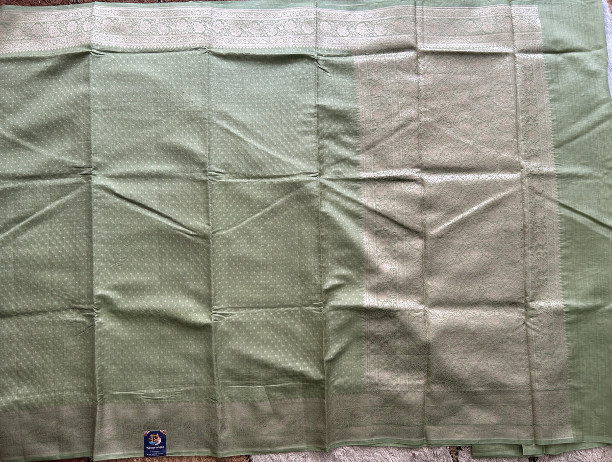 Pure Chiniya Silk Saree Mint Light Green Colored Elegantly Paired with a Gold Zari Border.