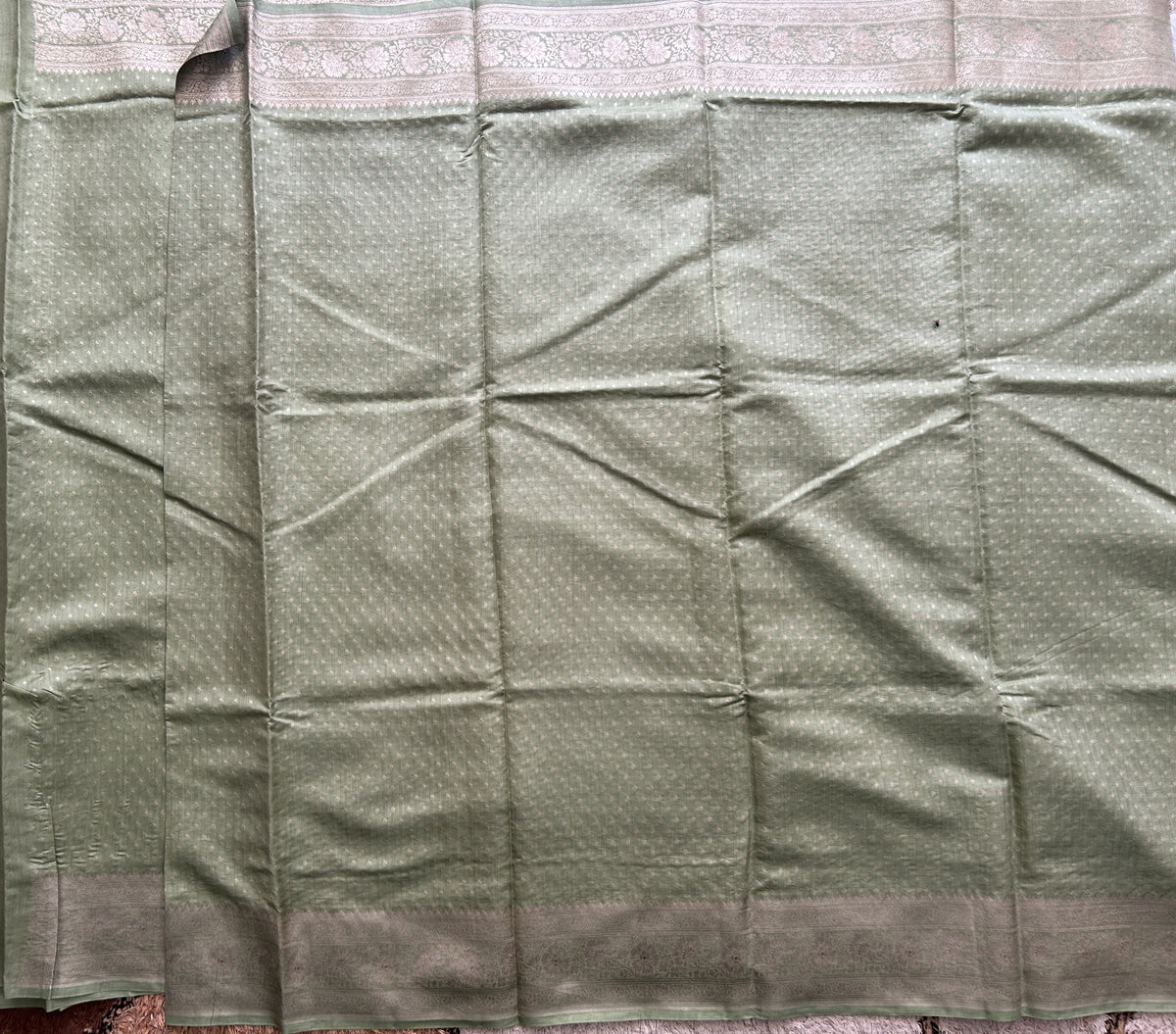 Pure Chiniya Silk Saree Mint Light Green Colored Elegantly Paired with a Gold Zari Border.