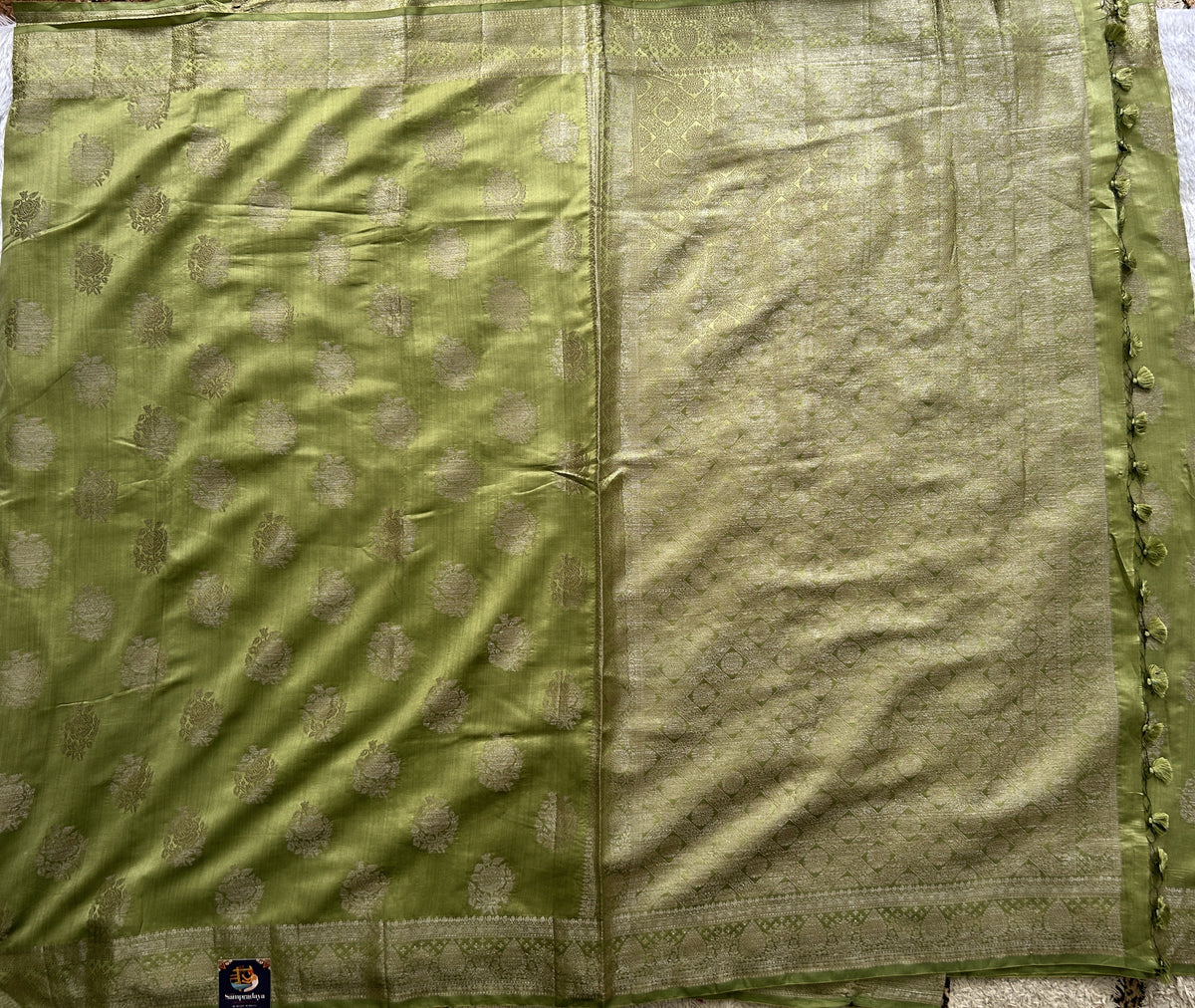 Pure Chiniya Silk Saree Mint Light Green Colored Elegantly Paired with a Gold Zari Border.
