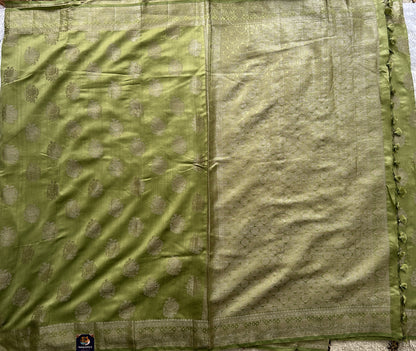 Pure Chiniya Silk Saree Mint Light Green Colored Elegantly Paired with a Gold Zari Border.