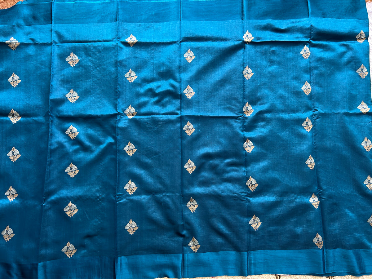 Pure Chiniya Silk Saree Mint Light Blue Colored Elegantly Paired with a Gold Zari Border.