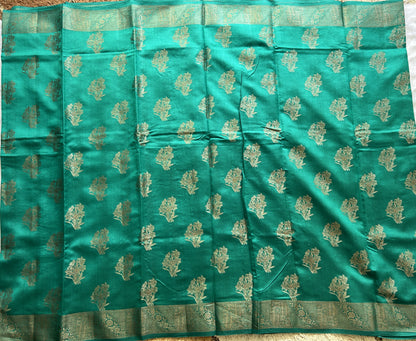 Pure Chiniya Silk Saree Rama Green Colored Elegantly Paired with a Gold Zari Border.