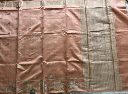 Pure Chiniya Silk Saree Peach Colored Elegantly Paired with a Gold Zari Border.