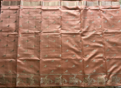 Pure Chiniya Silk Saree Peach Colored Elegantly Paired with a Gold Zari Border.