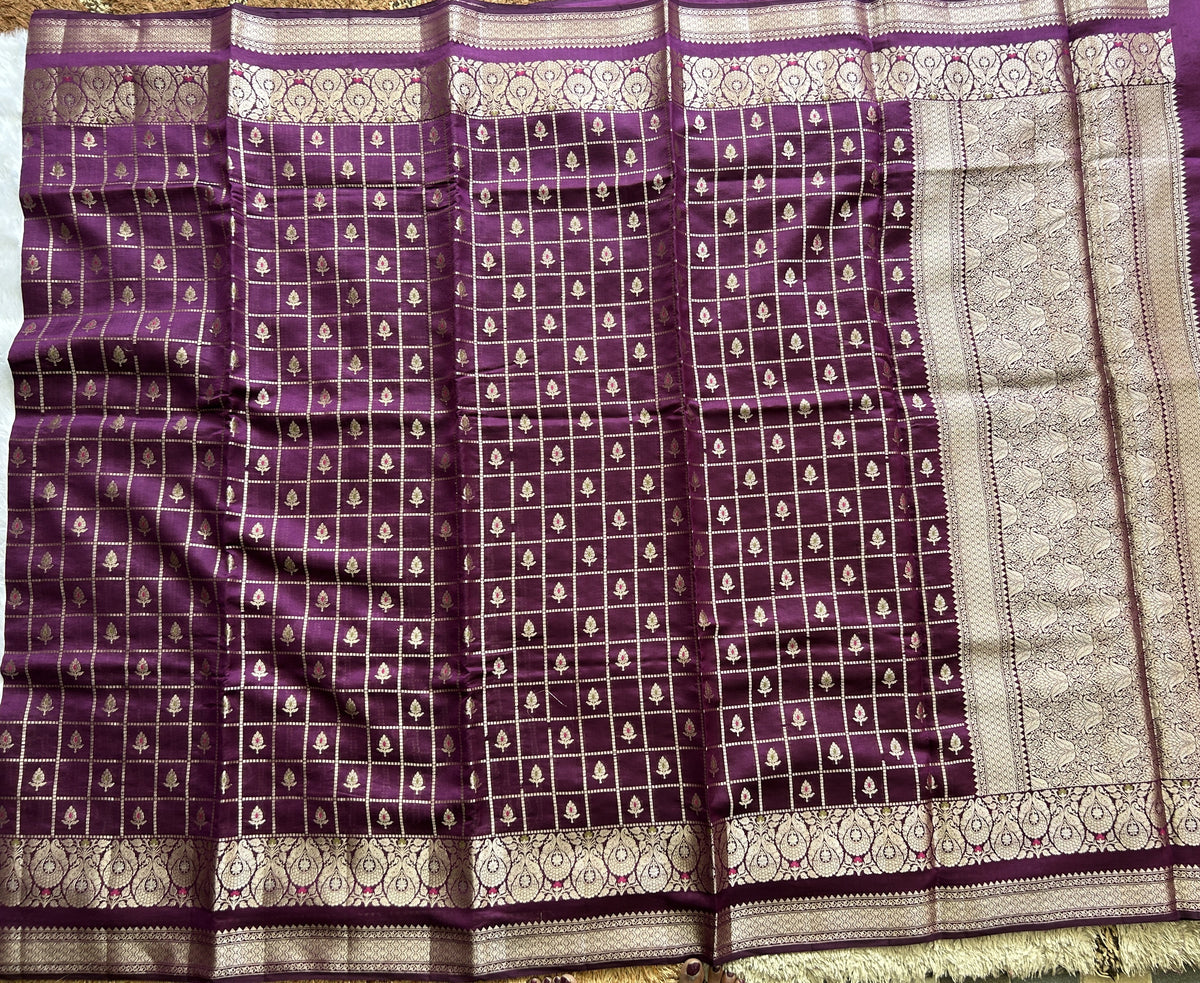 Pure Chiniya Silk Saree Violet Colored Elegantly Paired with a Gold Zari Border.