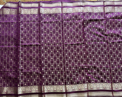 Pure Chiniya Silk Saree Violet Colored Elegantly Paired with a Gold Zari Border.