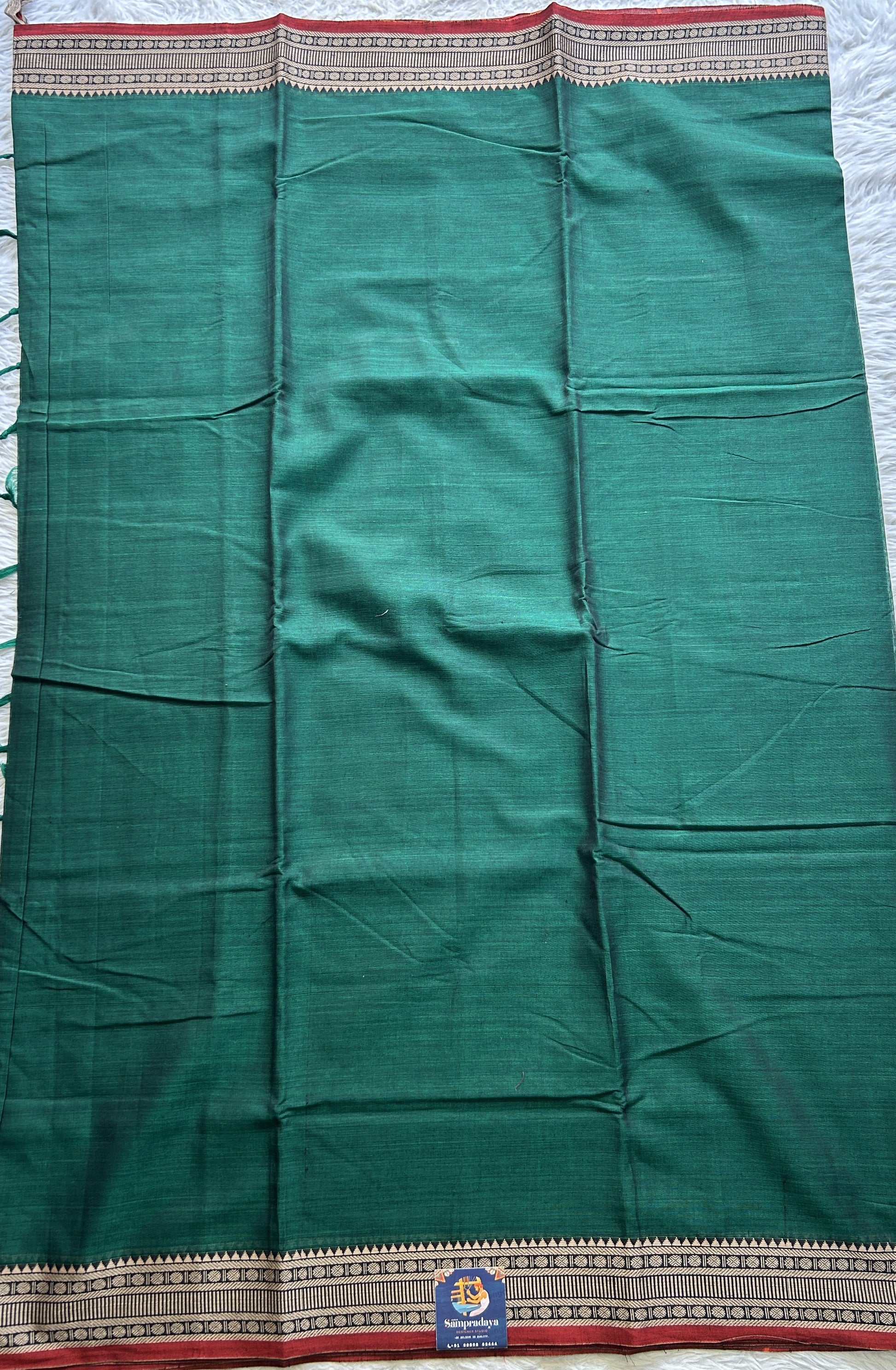Narayanpet Cotton Saree Forest Green Colored Complemented with a Thread Border. - Sampradaya Designer Studio