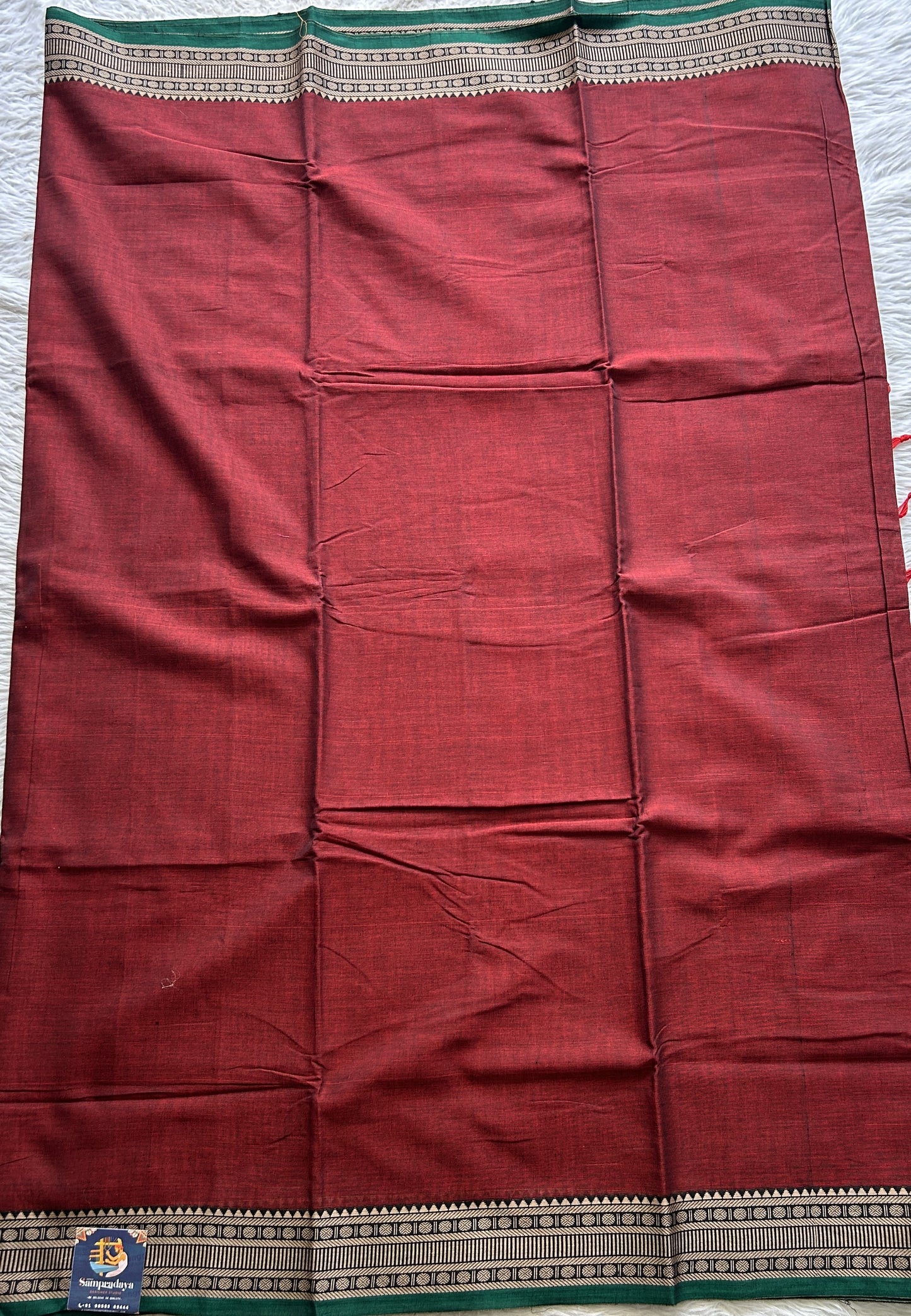 Narayanpet Cotton Saree Garnet Colored Complemented with a Thread Border. - Sampradaya Designer Studio