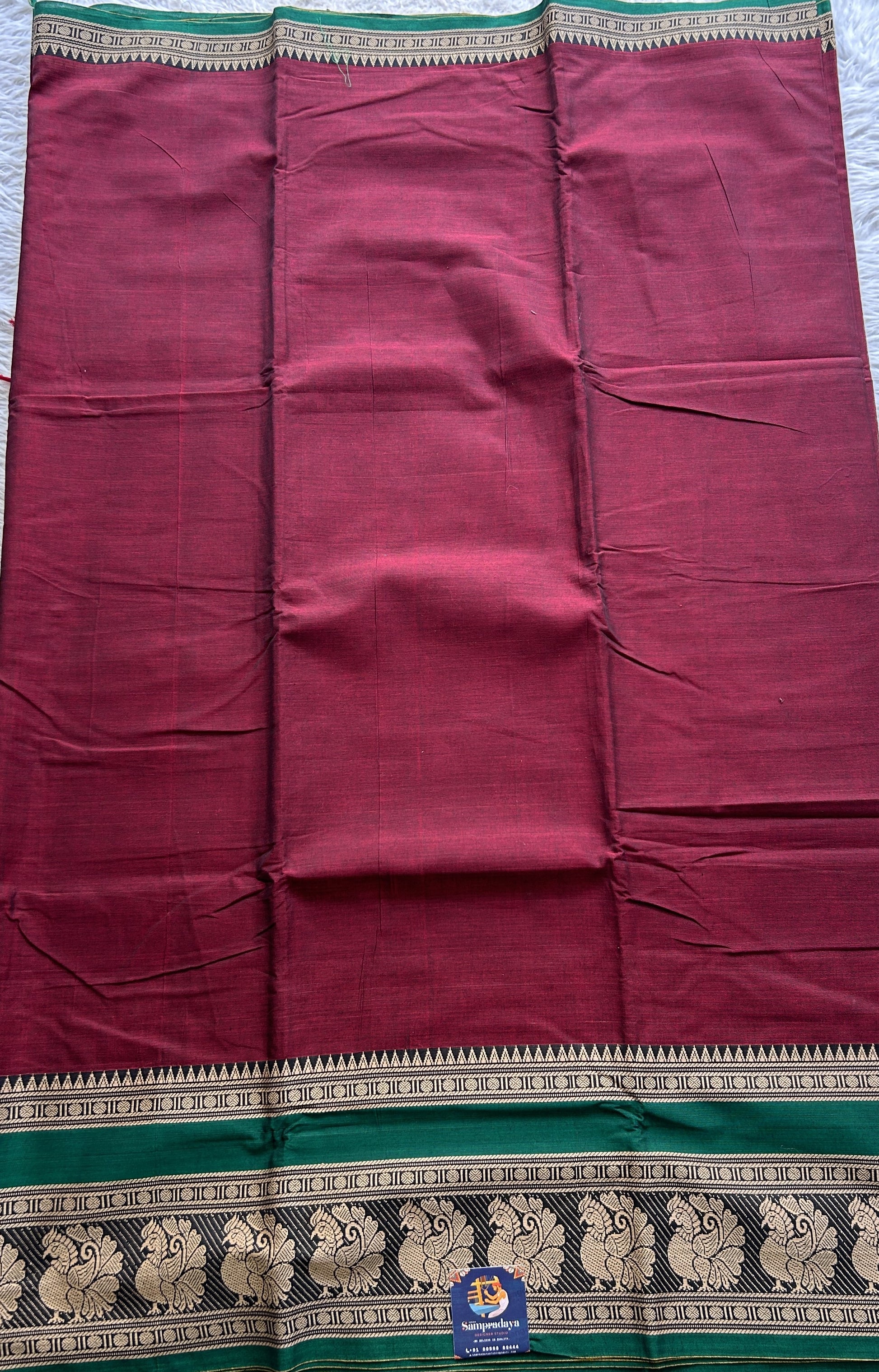 Narayanpet Cotton Saree Maroon Colored Complemented with a Peacock Border. - Sampradaya Designer Studio