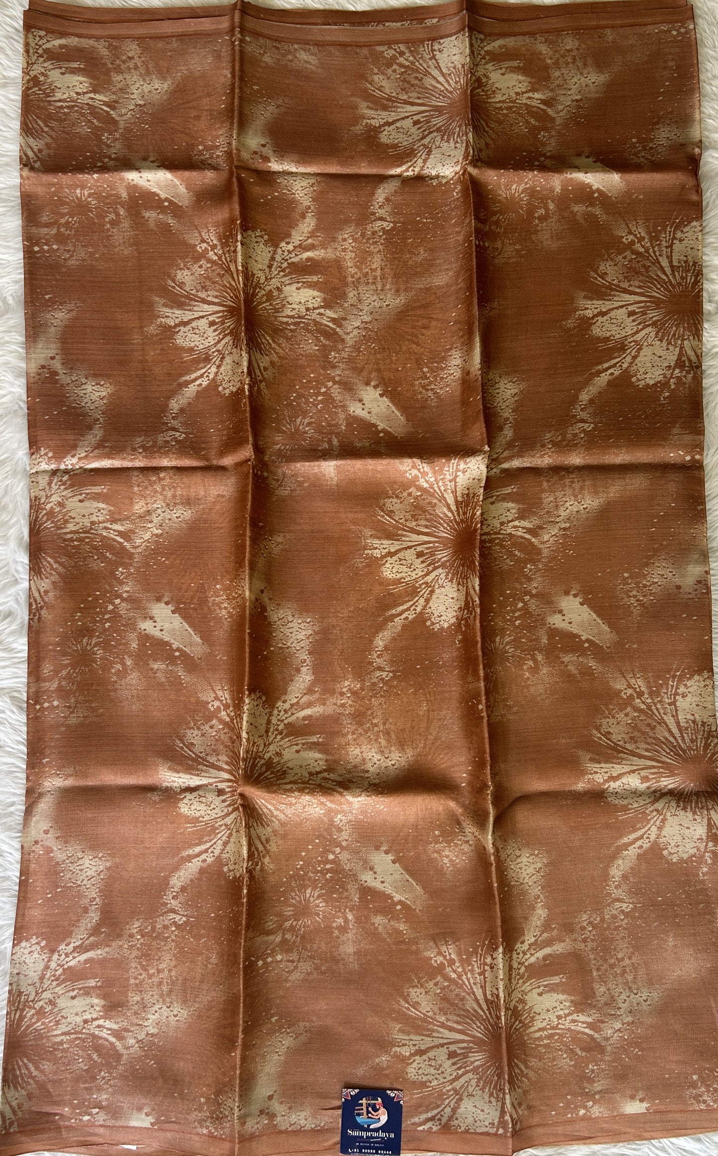 Banarasi Crepe silk Saree Rust colored complemented with a borderless. - Sampradaya Designer Studio
