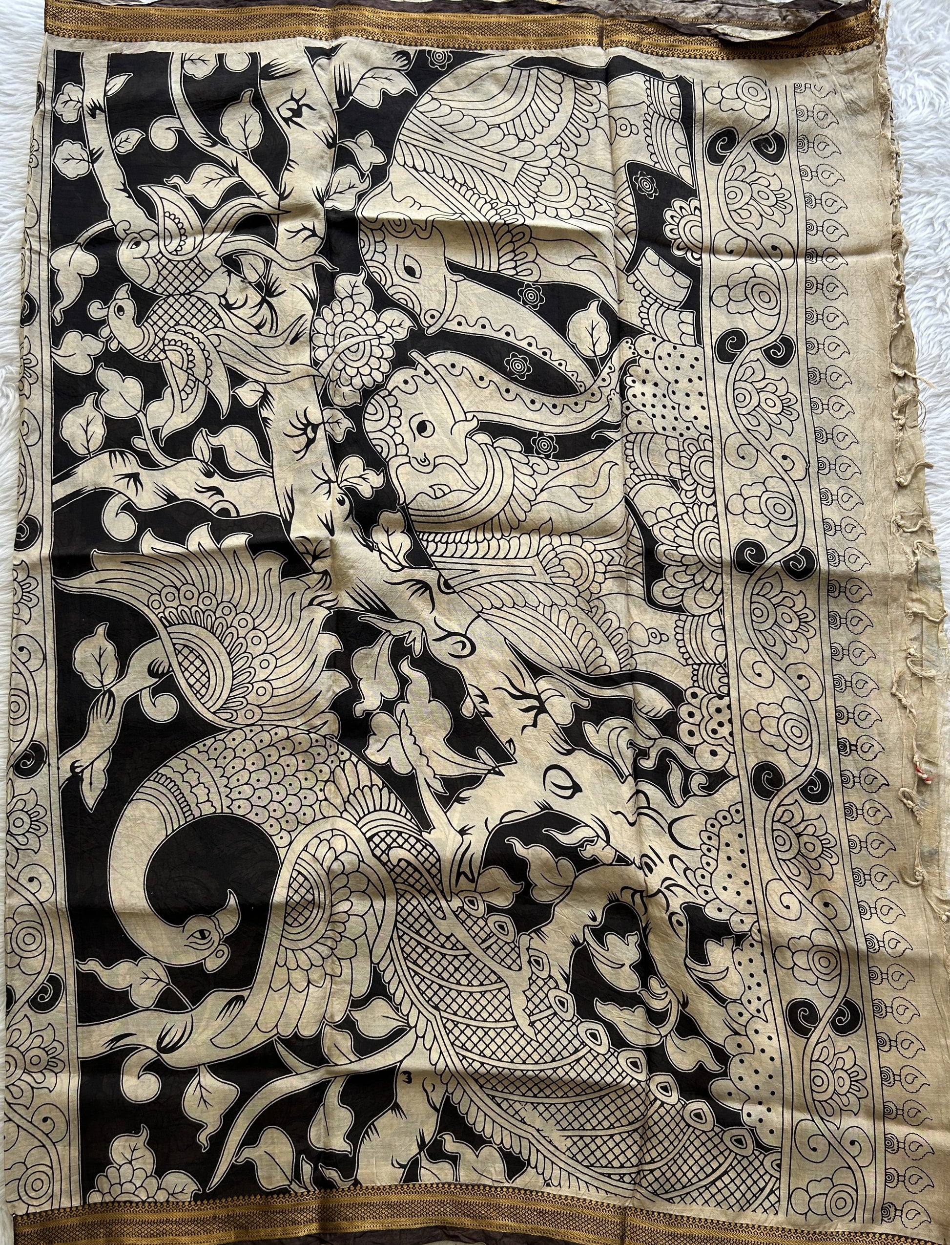 Pen Kalamkari Saree Beige colored complemented with a Brown Colored Gold Zari border - Sampradaya Designer Studio