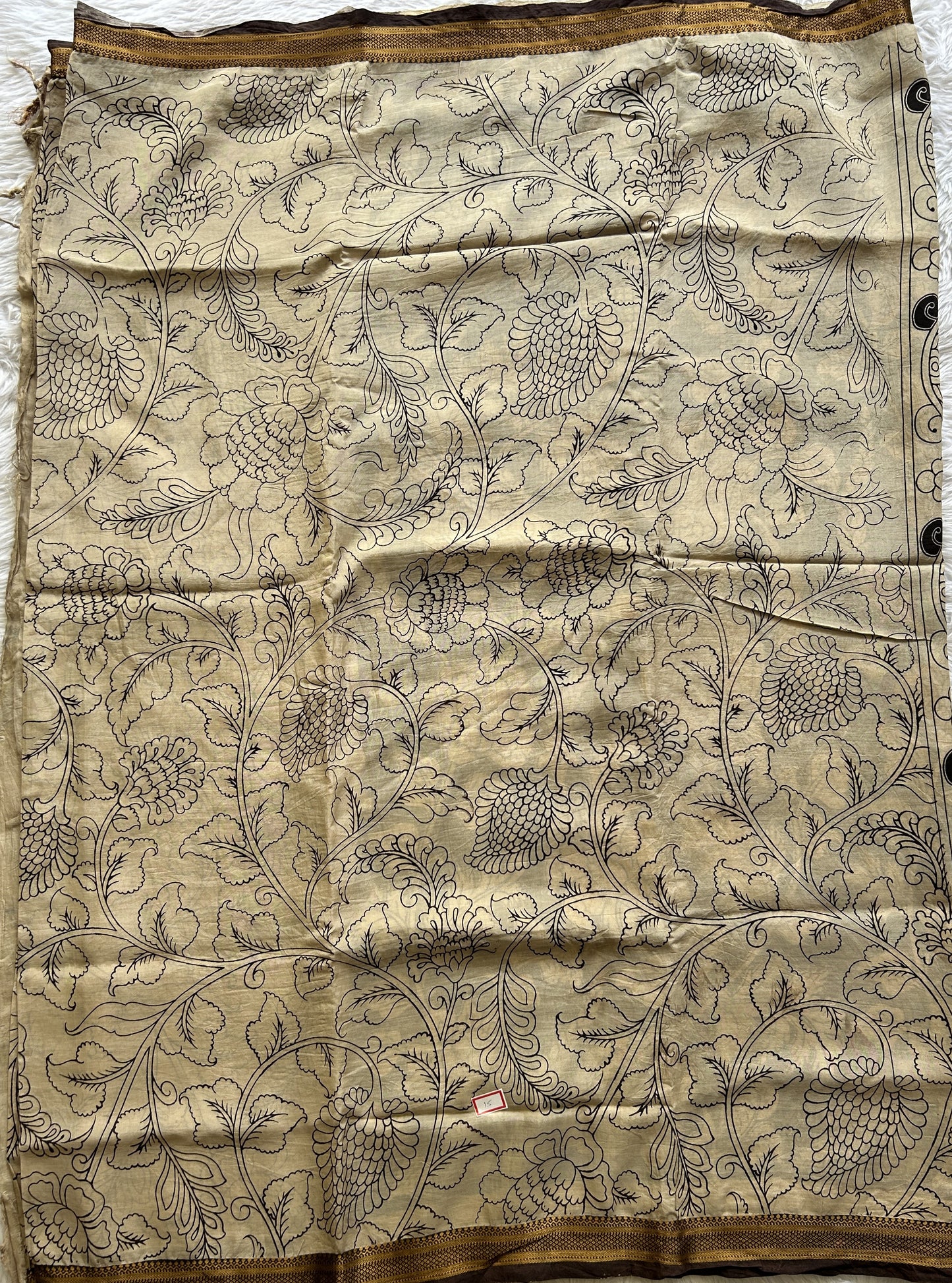 Pen Kalamkari Saree Beige colored complemented with a Brown Colored Gold Zari border - Sampradaya Designer Studio