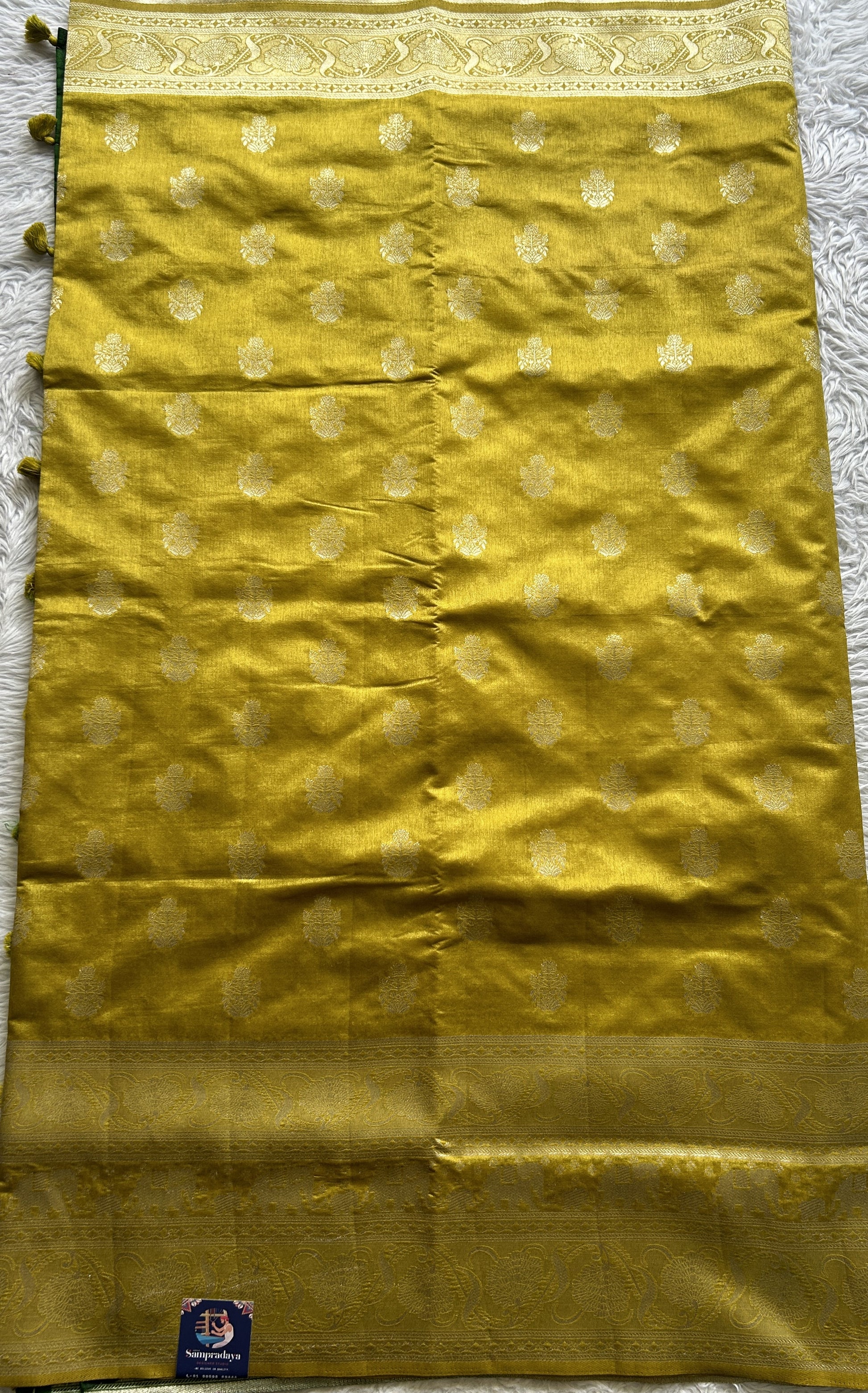 Semi Raw Silk Saree Fluorescent Green Colored Complemented with a Zari Border. - Sampradaya Designer Studio